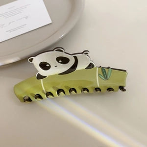 Detailed view of giant panda on bamboo hair claw clip made of acetate material