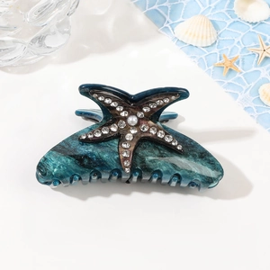 Pince à cheveux étoile de mer en acrylique marbré avec strass et détails de perles