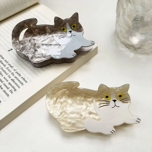 Cute cat-shaped hair claw clips in grey tortoiseshell and pearl white finishes