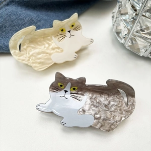 Cute cat-shaped hair claws with mother-of-pearl texture in cream white and taupe colors