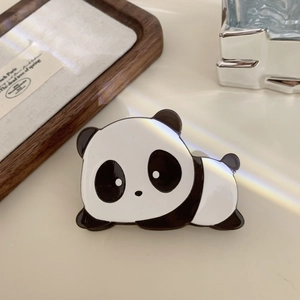 Detailed view of a cute panda hair claw clip made of glossy premium acetate material