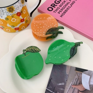 Creative fruit-shaped acetate hair claws including apple and lemon styles for hair styling
