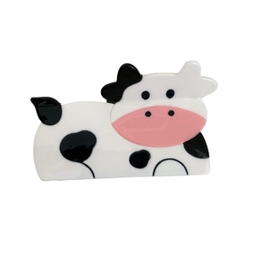 Cute cow shaped hair claw clip in black and white pattern for stylish hair styling