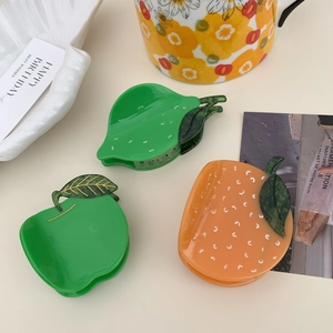 Cute acetate fruit claw clips set featuring green apple and lemon styles for women