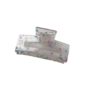Transparent candy-colored hair claw clip with rainbow dots for thick hair styling