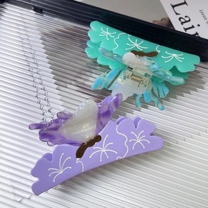 Elegant purple and mint green butterfly hair claws made of premium acetate for women