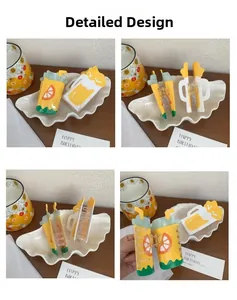 Detail of creative acrylic hair claws in drink cup shapes with metal spring closure