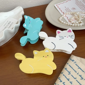 Set of three cute cat-shaped acetate hair claws in green, ivory, and yellow for women