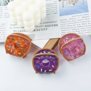 Three-piece set of colorful donut hair claws in orange, purple and pink glitter acetate