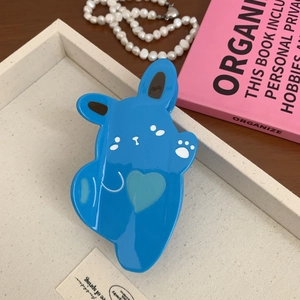 Detailed macro view of a cute blue rabbit-shaped acetate hair claw clip for women
