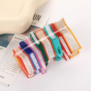 Rainbow book-shaped hair claw clip made of textured acetate for elegant hair styling