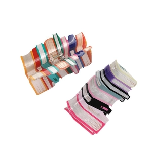 Rainbow book style hair claw clips with colorful vertical stripes in resin material