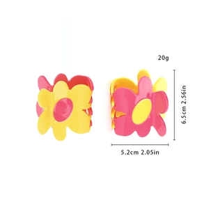 Detail view of flower hair claw clip with yellow and pink contrast and 6.5cm dimensions