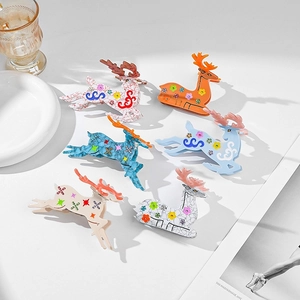 Set of six colorful acetic acid reindeer hair claws with rhinestones and floral patterns