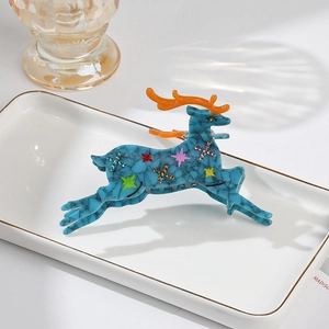 Blue marble acetic acid reindeer hair claw clip with rhinestones and orange antlers