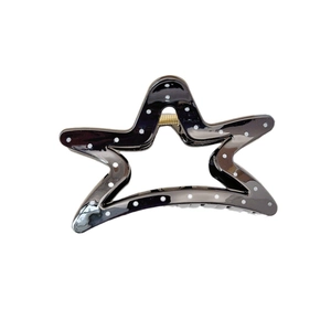 Star shaped black hair claw clip with white polka dots and golden metal spring mechanism
