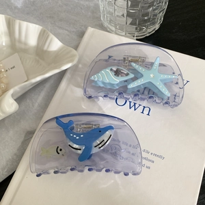 Ocean series hair claws with starfish and blue whale designs on elegant purple acrylic