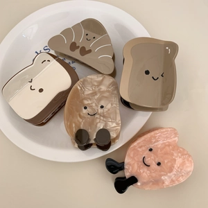 5-piece set of croissant and toast shaped acetate hair claws with cute cartoon smiles