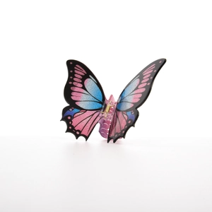 Close-up of butterfly hair claw with pink-blue gradient finish and golden spring