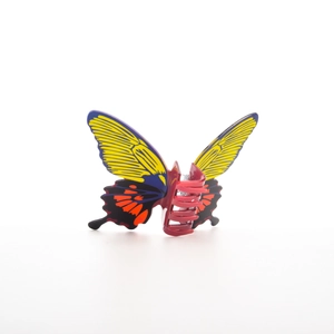 Close-up of a large colorful butterfly hair claw clip with realistic wing patterns