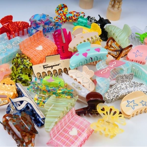Assorted acetate hair claws in various shapes and vibrant colors for stylish women