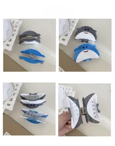 Detail view showing different angles of pufferfish hair claw clips in blue and grey