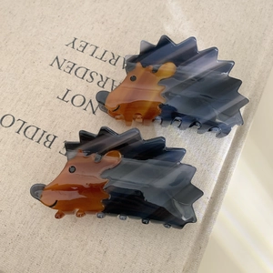 Cute hedgehog cellulose acetate hair claw clips in dark grey and amber brown marble pattern