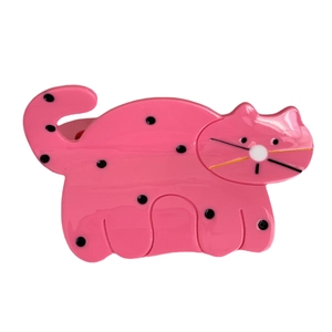 Pink cartoon cat hair claw clip with black polka dots made of glossy acetate material