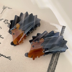 Cute hedgehog-shaped acetate hair claw clips in dark grey and amber brown finish