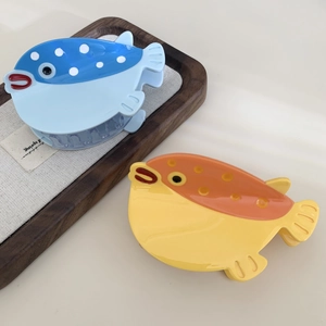 Creative pufferfish hair claws in blue and orange colors with high-gloss resin finish