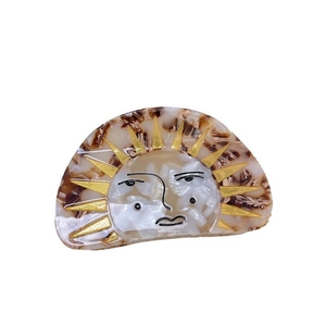 Pince à cheveux créative en acétate avec visage de soleil et motif écaille de tortue
