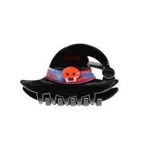 Halloween witch hat hair claw clip with skull detail and purple ribbon on white background