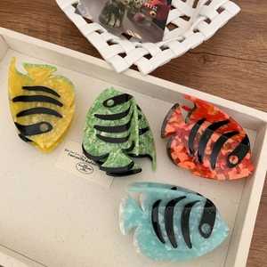 Set of four striped tropical fish hair claws in colorful acetate with marble texture