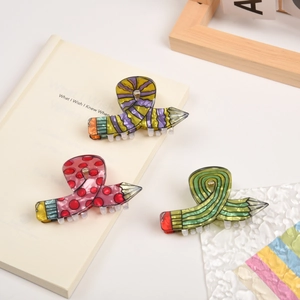 Creative pencil-shaped hair claw clips set in pink, yellow, and green acetate finish