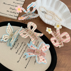 Set of 5 floral and cherry bow shark hair clips in pastel blue, pink, and cream