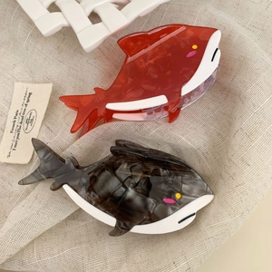 Cartoon shark hair claw clips made of colorful acetate material in red and tortoiseshell