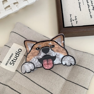Detail view of a cute Corgi hair claw clip made of marble texture acetate material
