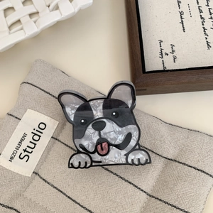 Detail of French bulldog acetate hair claw clip with black and white marble texture