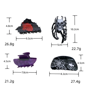 Detail view of Halloween hair clips with skull heart and spider web motifs in four styles