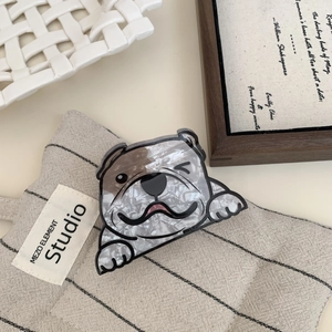 Detail view of acrylic bulldog hair claw with marble texture on a lifestyle background
