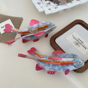 Fish-shaped acetate hair claw clips with marble texture and colorful fin details