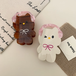 Cute acetate cat hair claws with headphones and winking expression in amber and cream