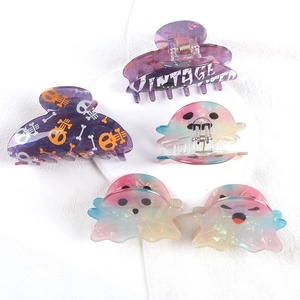 Spooky Halloween hair claw clips set with ghost designs and skull patterns on white base