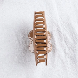 Brown heart-shaped hair claw clip with rhinestones for elegant women's updos