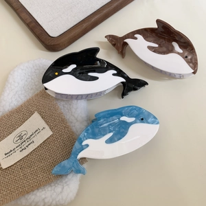Pinces à cheveux baleine et dauphin en acétate coloris noir bleu et marron brillant