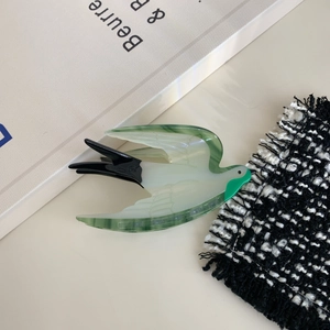 Elegant bird shaped acetate hair claw clip with green gradient and swallow design details