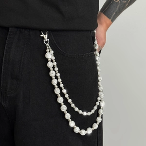 Hip hop silver layered trouser chain with sparkling rhinestones on black jeans
