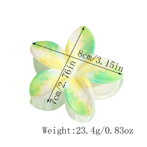 Detailed view of floral hair claw showing dimensions 8cm by 7cm and 23.4g weight