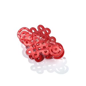 Red acetate hair claw clip featuring a traditional Chinese knot design with tiny rhinestones