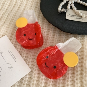 Minimalist red marble acetate shark hair clips with smile faces and yellow accents